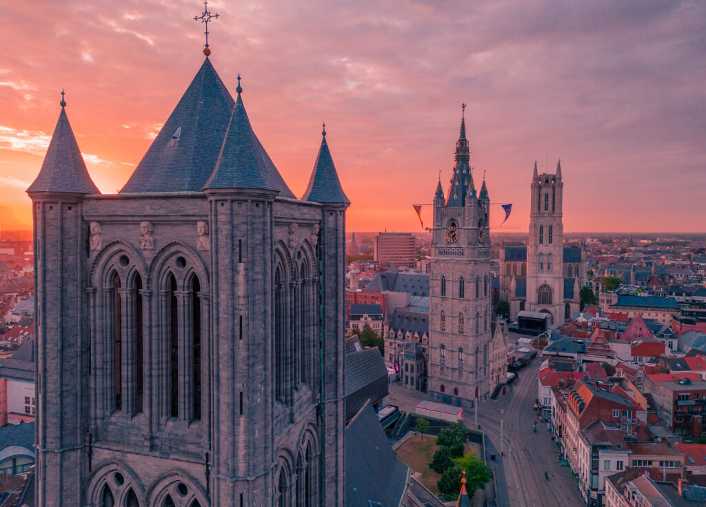 drone image of belfry and Cathedral of Ghent