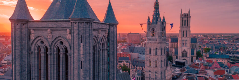 drone image of belfry and Cathedral of Ghent