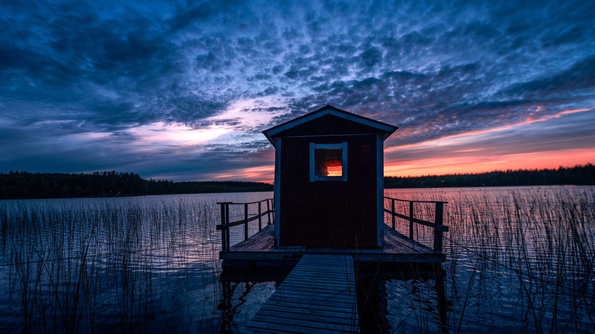 Sauna on lake at sunset Lakeside Cabin retreat