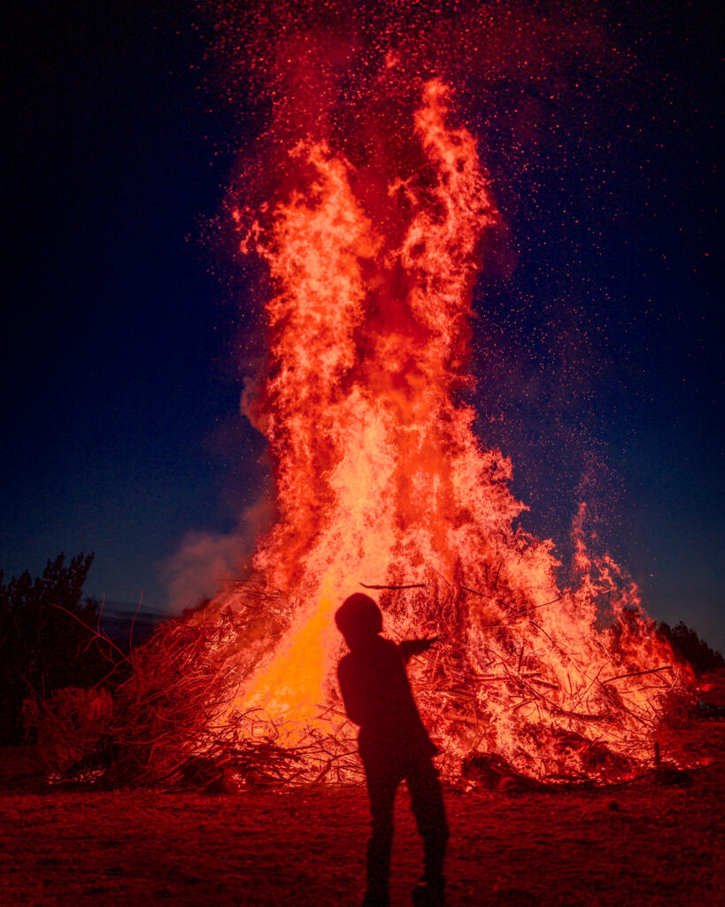 Kid playing with Fire - Walpurgis Night (Valborg) Bonfire (majbrasa) - Uppsala Sweden