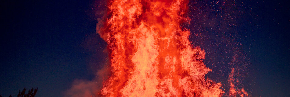 Kid playing with Fire - Walpurgis Night (Valborg) Bonfire (majbrasa) - Uppsala Sweden