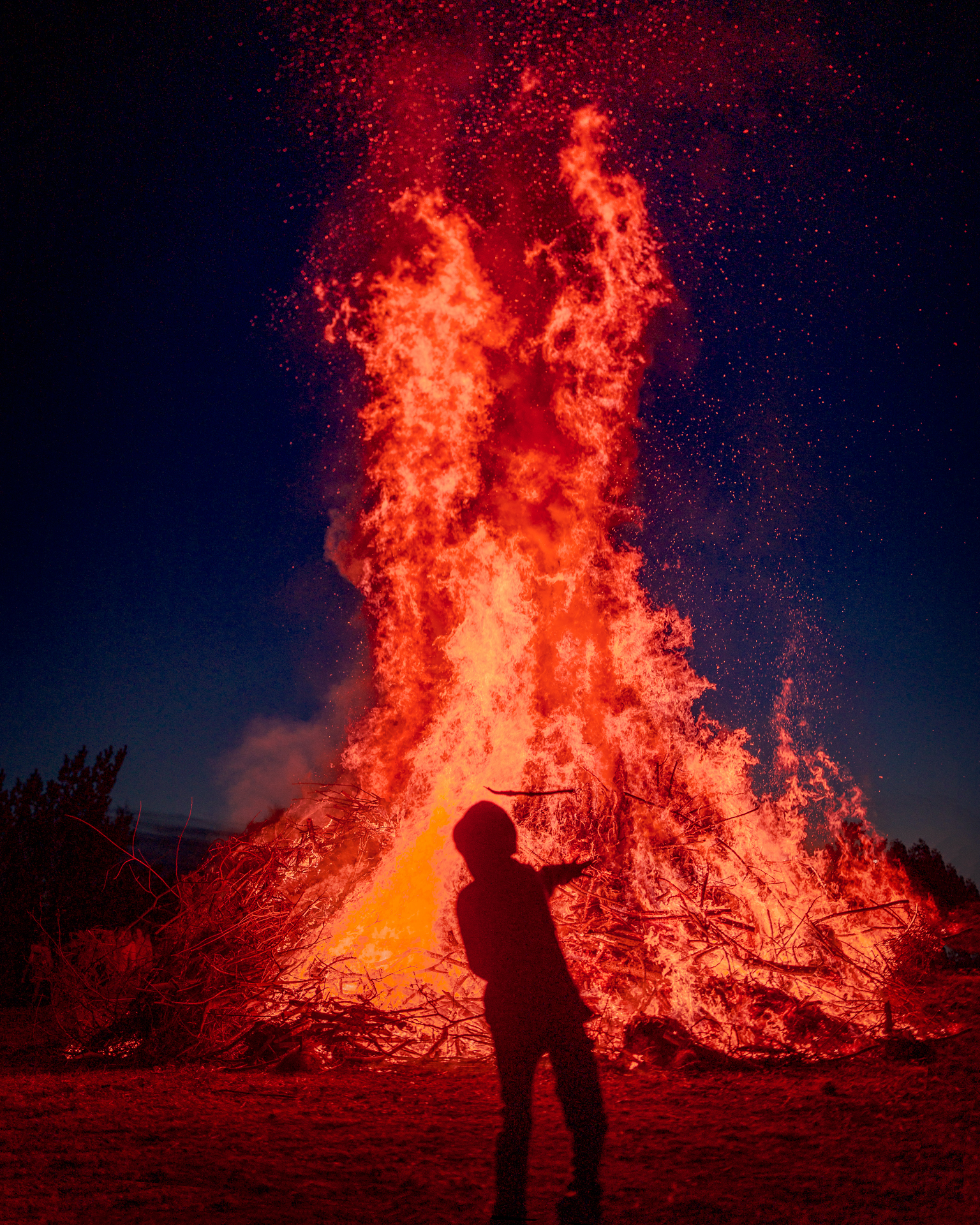 Kid playing with Fire - Walpurgis Night (Valborg) Bonfire (majbrasa) - Uppsala Sweden