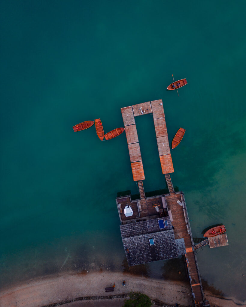 Lago-di-Braies-Dolomites-Lake-Family-road-trip-in-northern-italy-boats-from-above-drone-shot