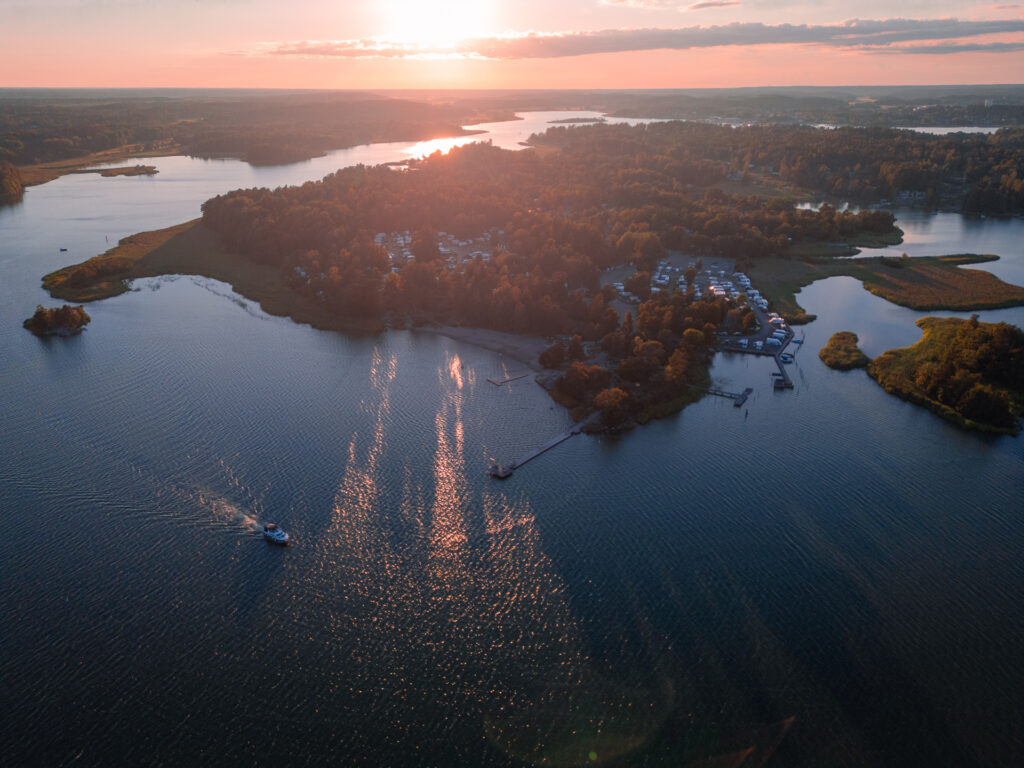 Trosa-Havsbad-Camping-Sunset-Drone-Shot-from-ocean
