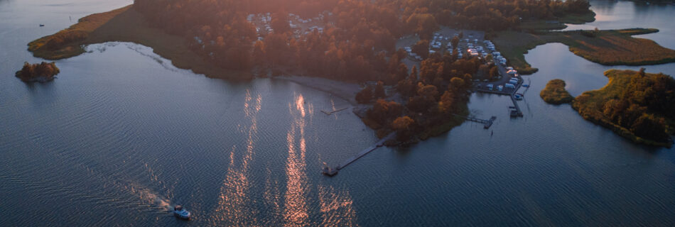 Trosa-Havsbad-Camping-Sunset-Drone-Shot-from-ocean