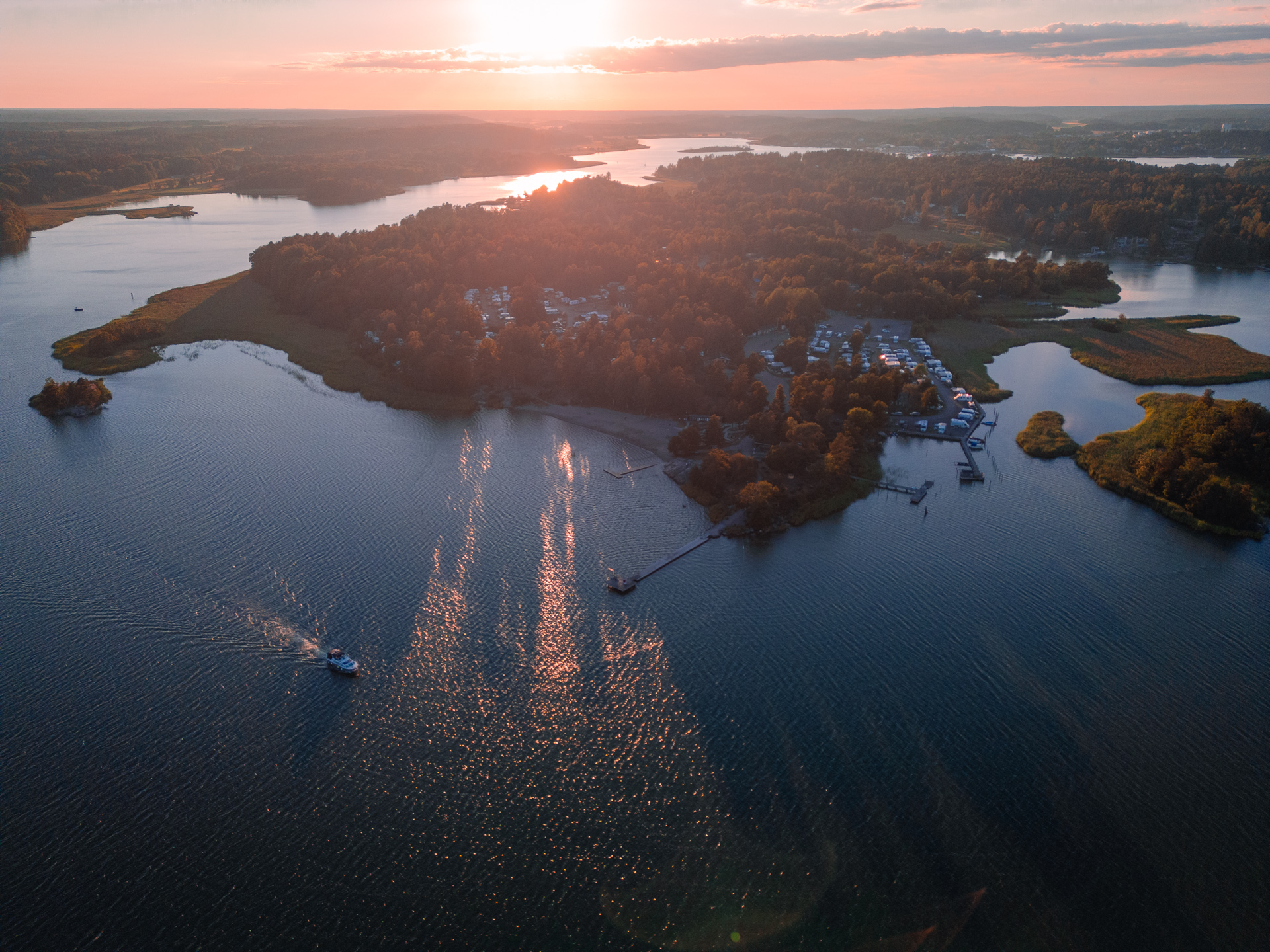 Trosa-Havsbad-Camping-Sunset-Drone-Shot-from-ocean