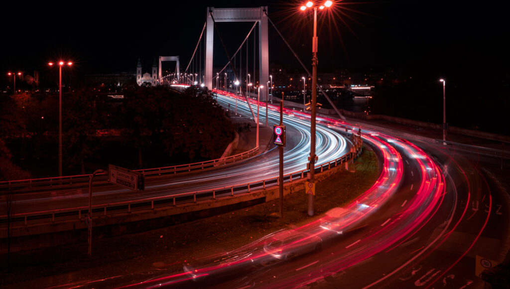 Erzsébet Bridge Night Traffic - Light Trails over Danube
