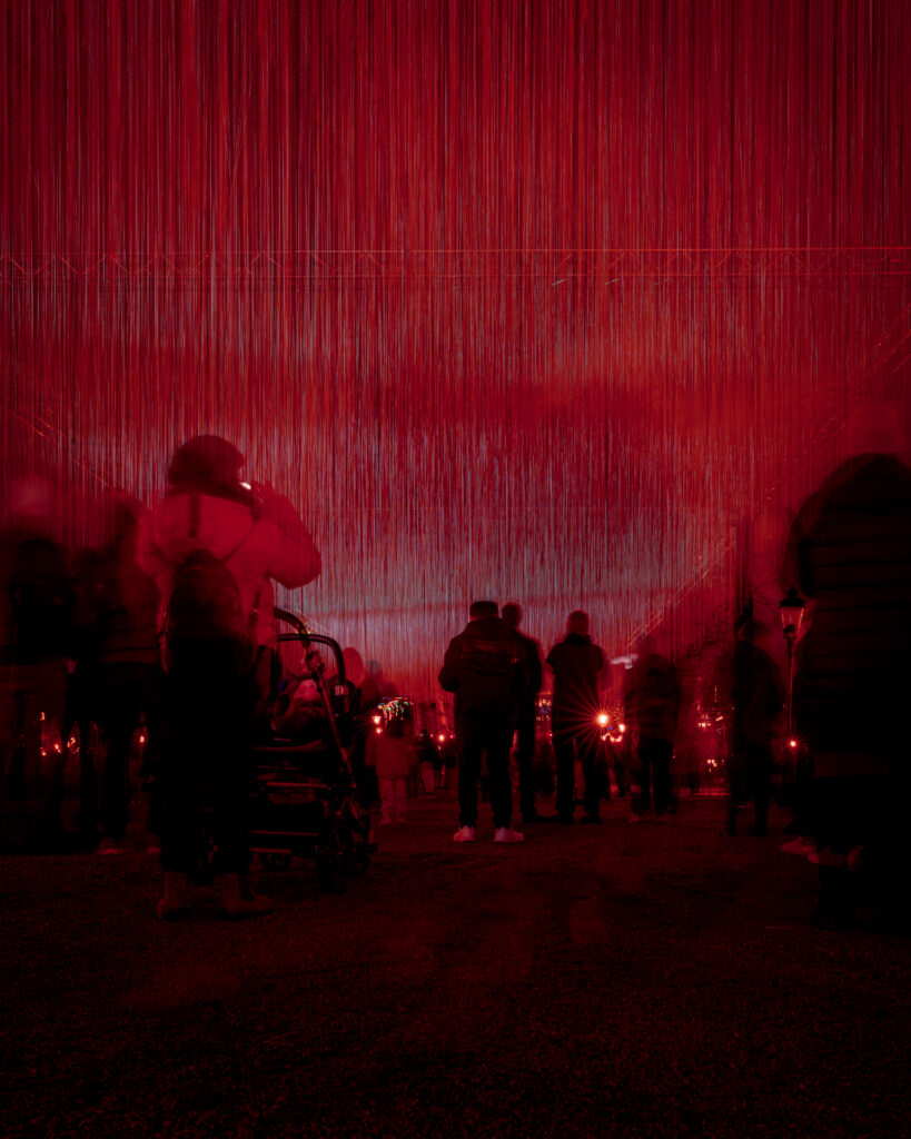 Nobel Week Lights 2025 Stockholm - Royal Sky - Crowd under Sky of red light