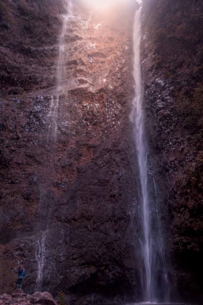 Levada do Caldeirão Verde hike PR9 on Madeira Island - Huge Waterfall Caldeirão Verde next to hiker