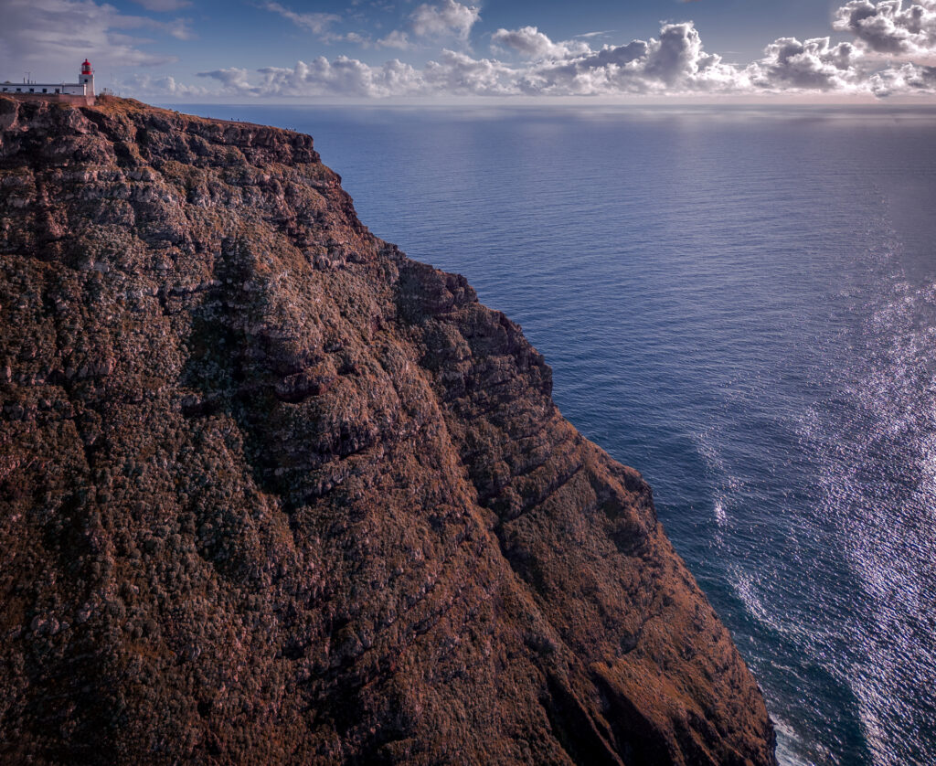 Miradouro Farol Da Ponta Do Pargo Viewpoint Sunset - Lighthouse on Top of Steep Cliff - Drone Shot