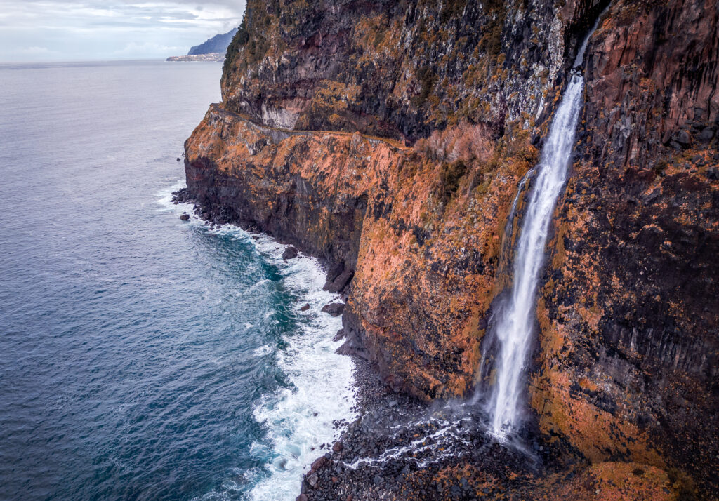 Miradouro do Véu da Noiva near Seixal Madeira Portugal - Waterfall Steep Cliff and Ocean