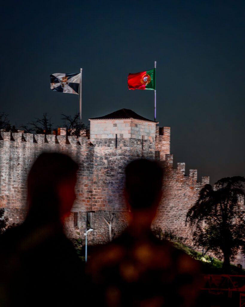 Miradouro da Graça - Best Sunset Viewpoint in Lisboa Portugal - Friends in Front of São Jorge Castle