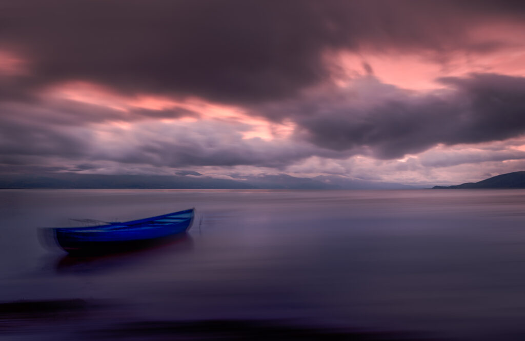 Long exposure Boat at Sunset at Prespa Lake -  North Macedonia - Photography Road Trip in the Balkans