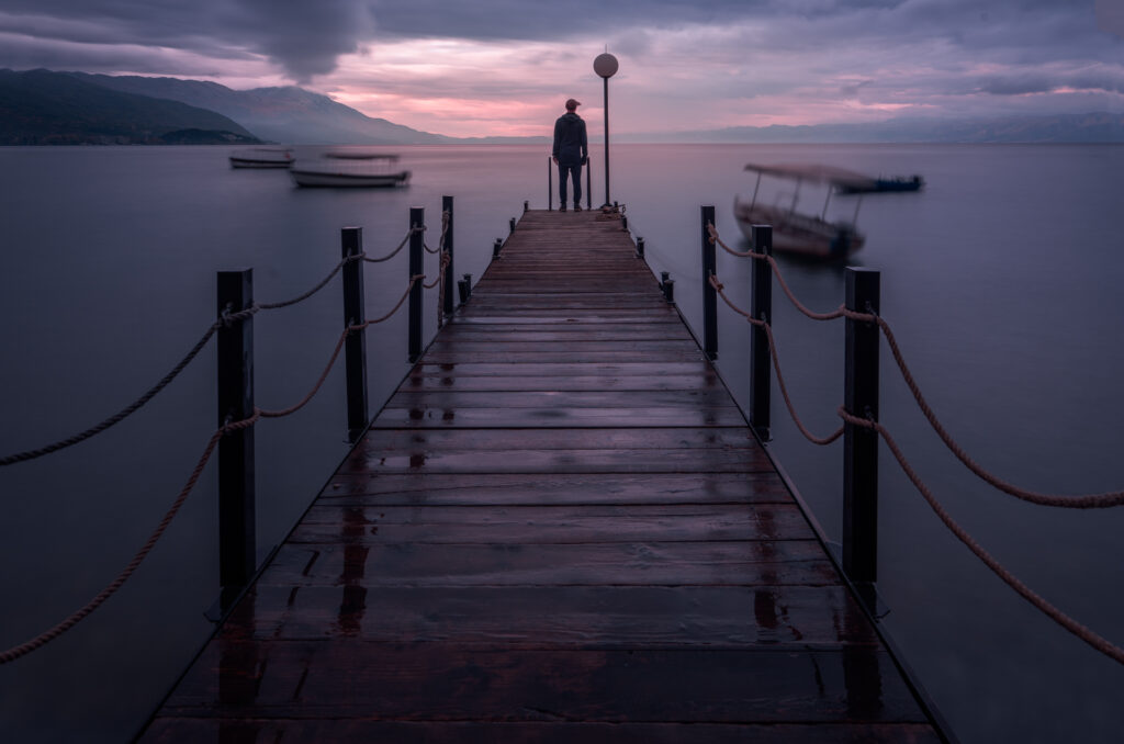 Ohrid Boardwalk Lake Ohrid Looking out Alone Blurry Boats - Ohrid Old Town - North Macedonia - Balkan Photography Roadtrip