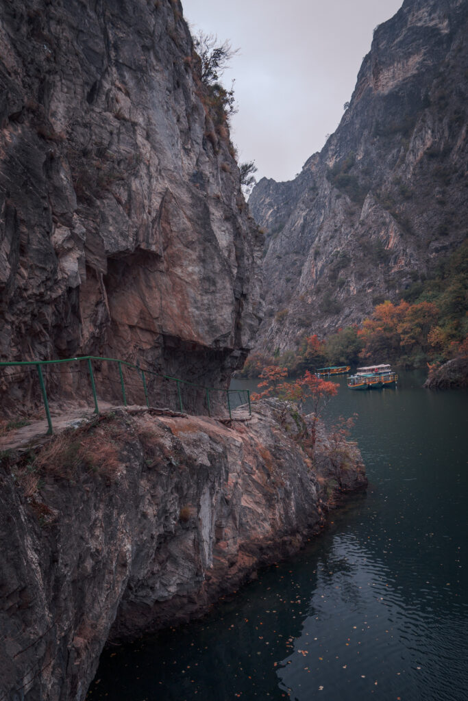 Trail Cliffs River and Boats at Matka Canyon Trail - National Park - North Macedonia - Photography Road Trip in the Balkans